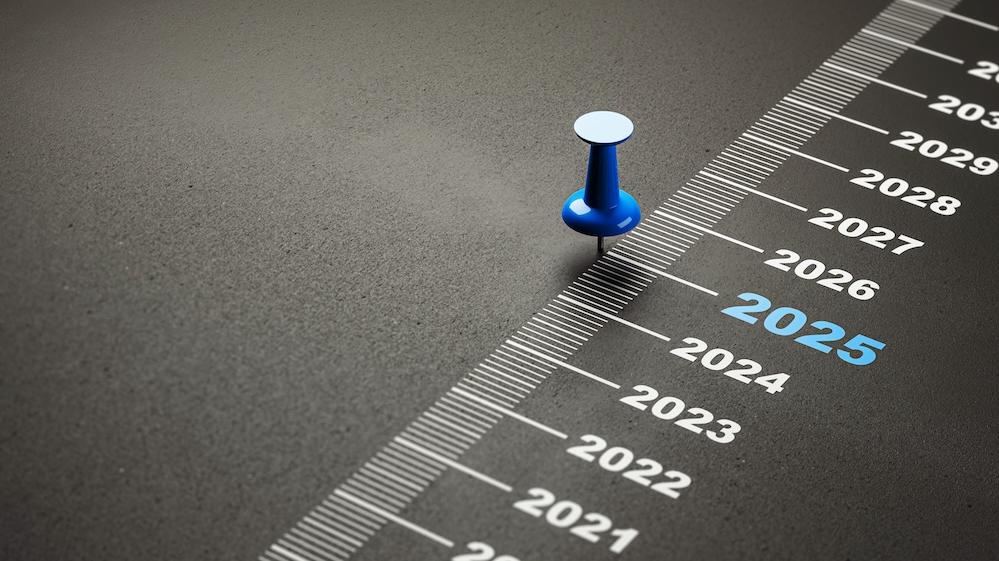 tack marking 2025 on a timeline