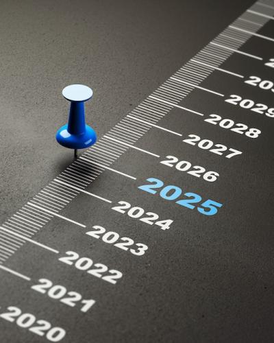 tack marking 2025 on a timeline